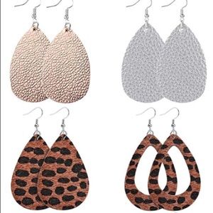 Set of four faux leather earrings.